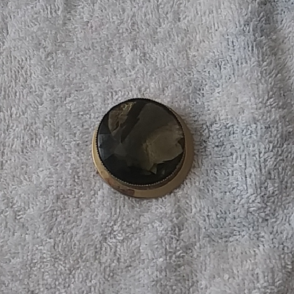 Not Rated Black and Gold Brooch
